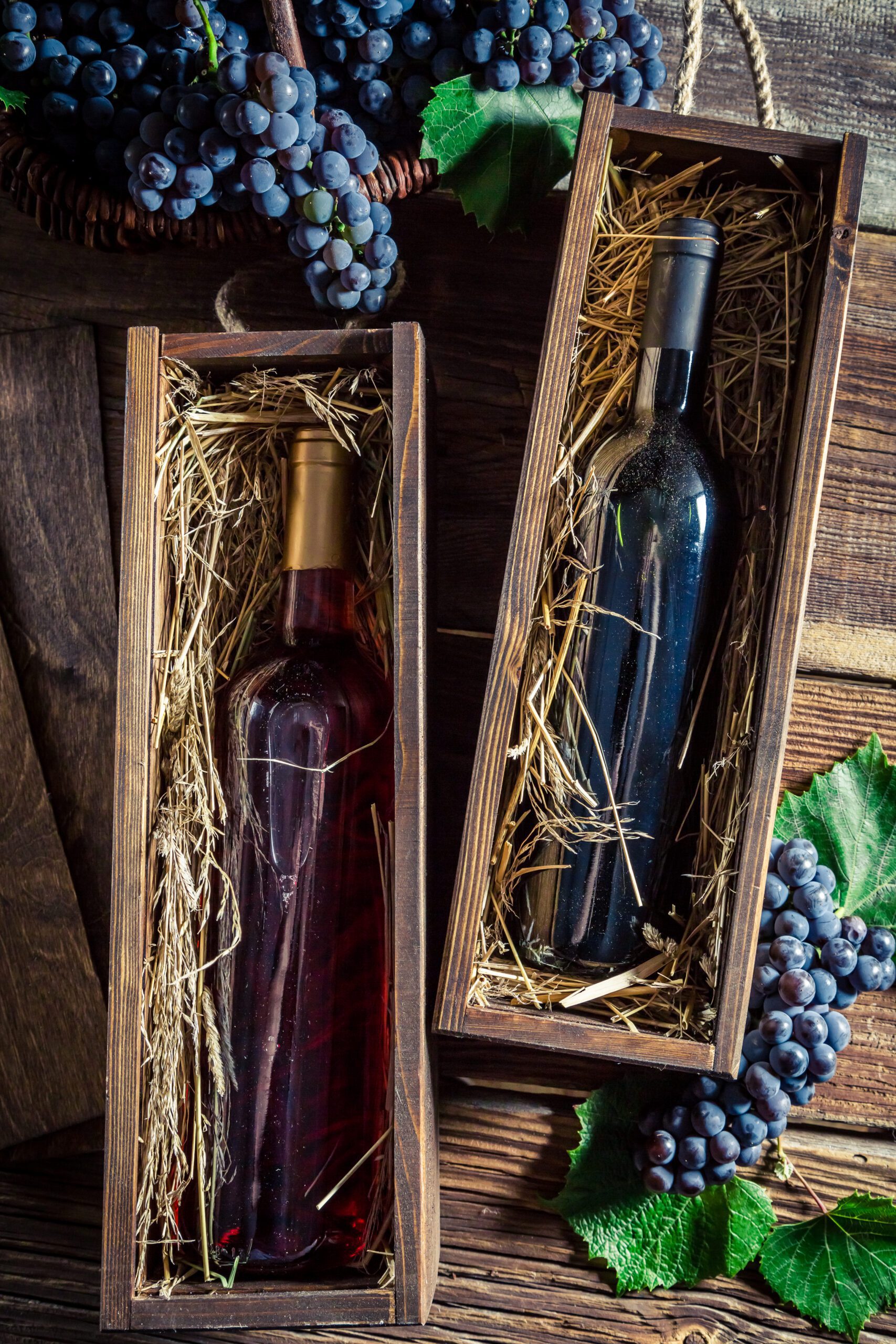 Fresh red wine in old wooden box